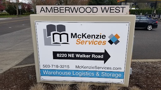 McKenzie Services Entrance Sign, Trucks in McKenzie Services Parking lot, Oregon 3PL Prep Center
